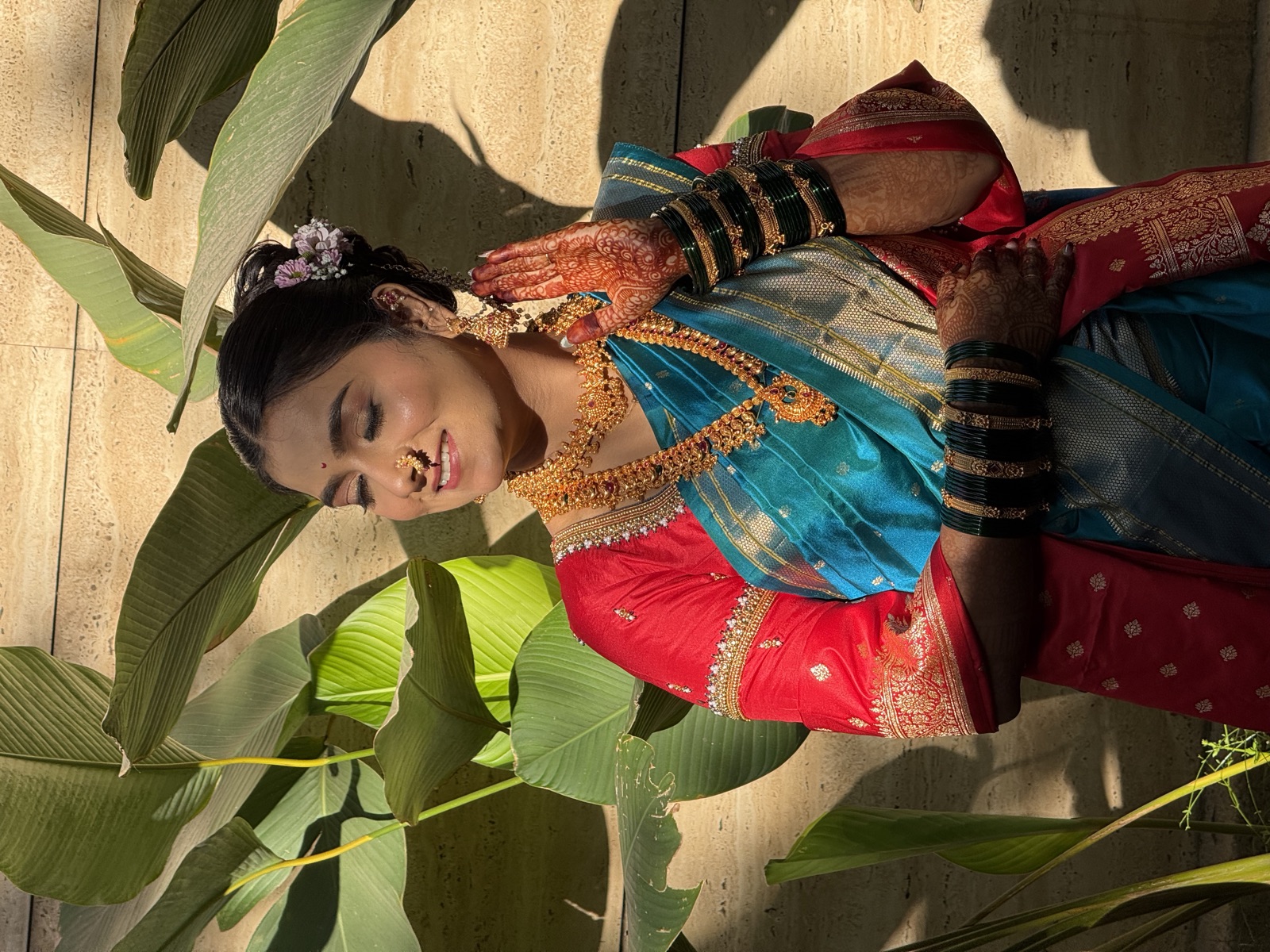 Traditional Maharashtrian look in a teal nauvari saree