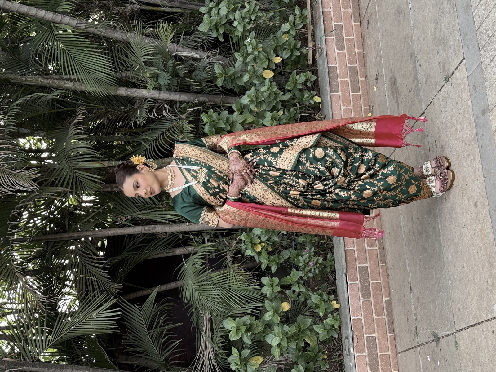 Traditional Maharashtrian look in a green nauvari saree, full-length