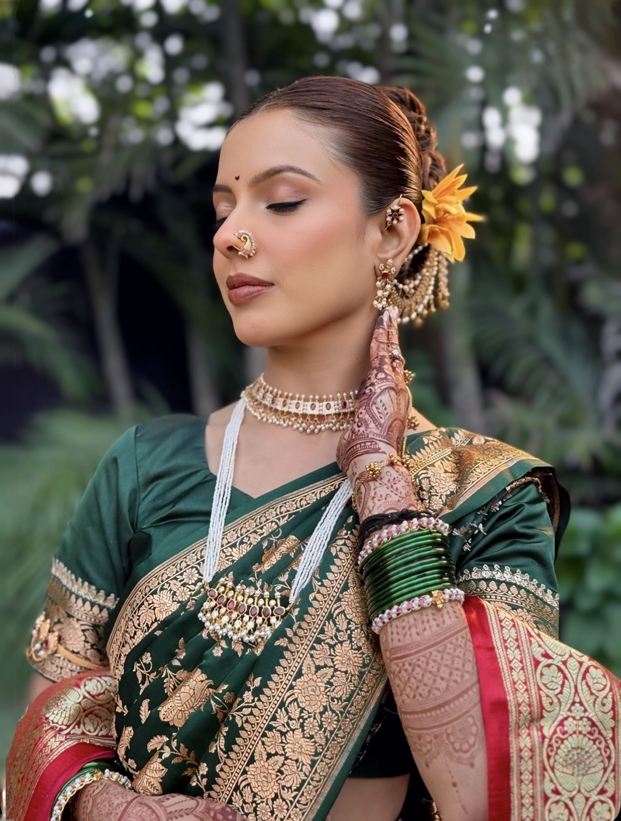 Traditional Maharashtrian look with a nath and a flower in the hair