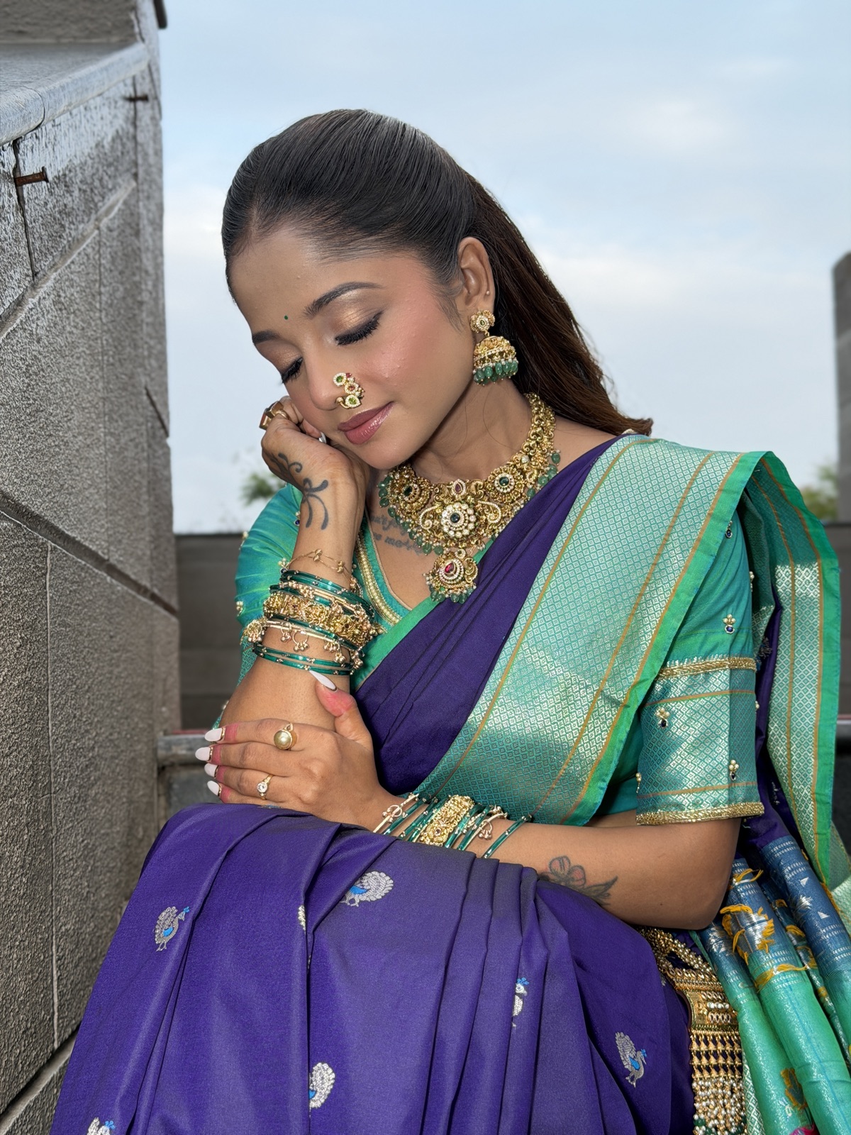 Traditional Maharashtrian look in a purple saree with a nath