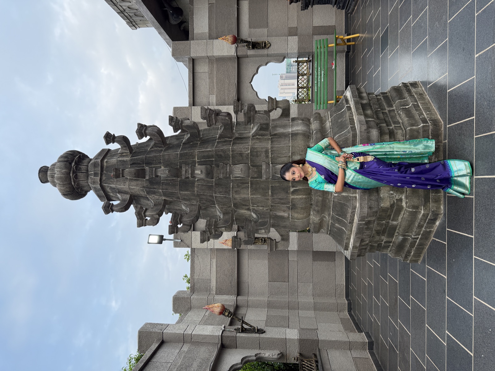 Full-length nauvari saree drape at a Maharashtrian monument