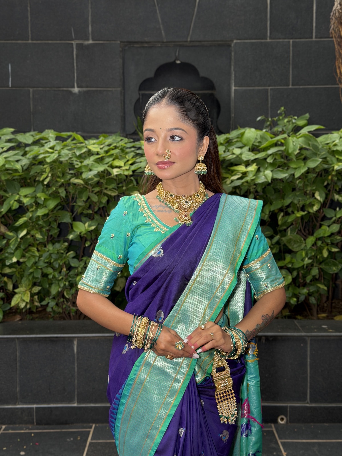 Party look with glam makeup in a blue saree