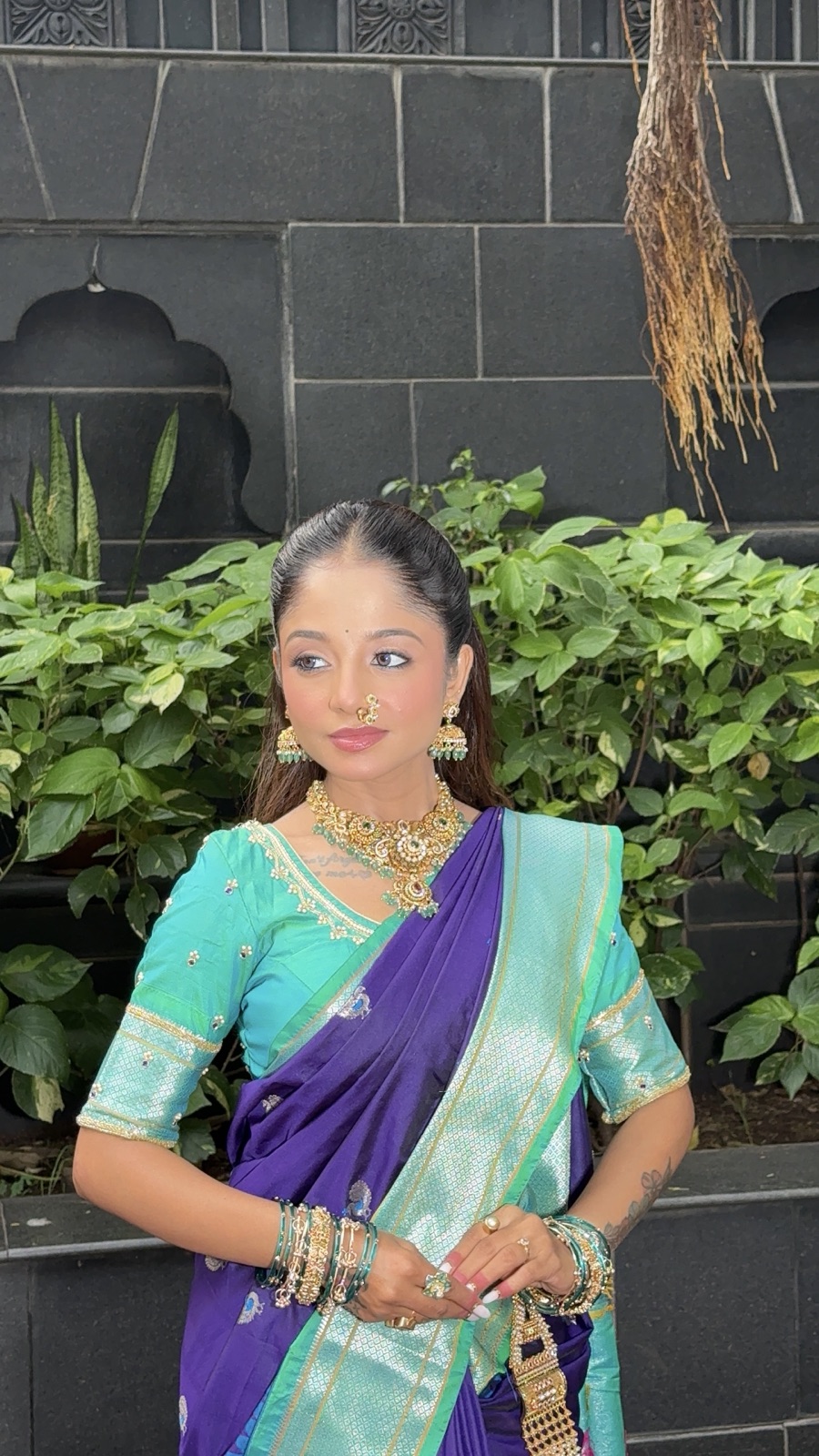 Guest glam look in a purple-and-teal saree