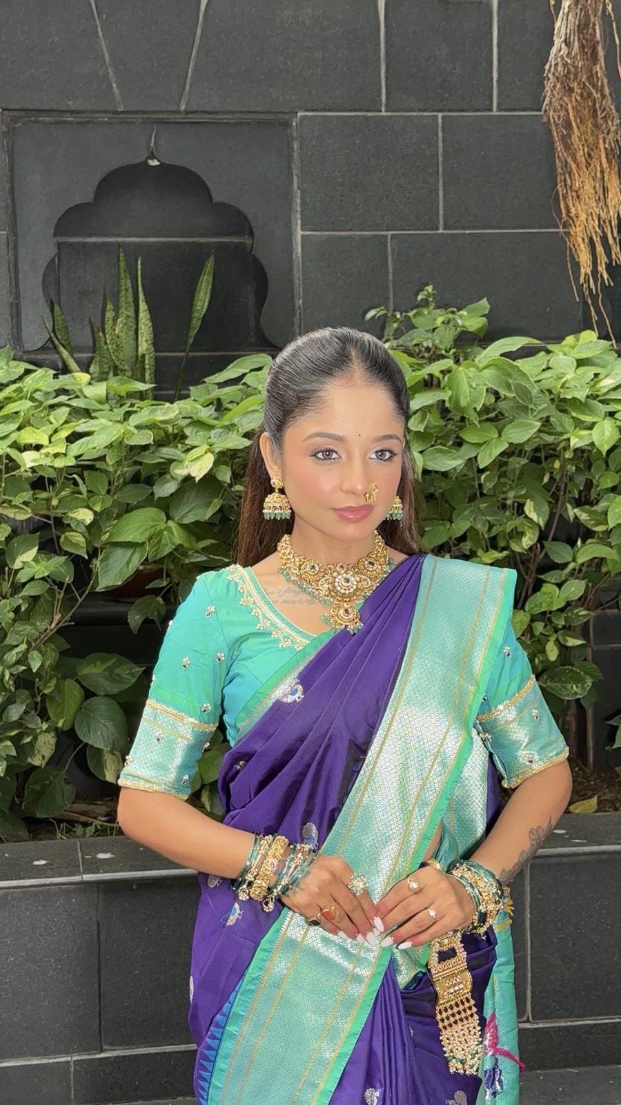 Camera-ready guest glam look in a purple-and-teal saree